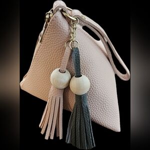 Pink Textured Handbag with Tassels
